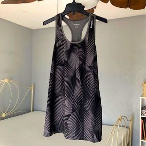 Grey and black patterned rebook athletic top.